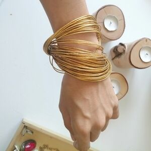 Gold bracelet| fashionably intertwined